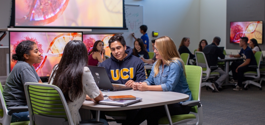 students discussing science at a table