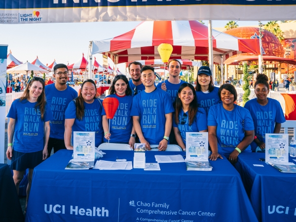 This is an image of CFCCC personnel posing at a table at an event.